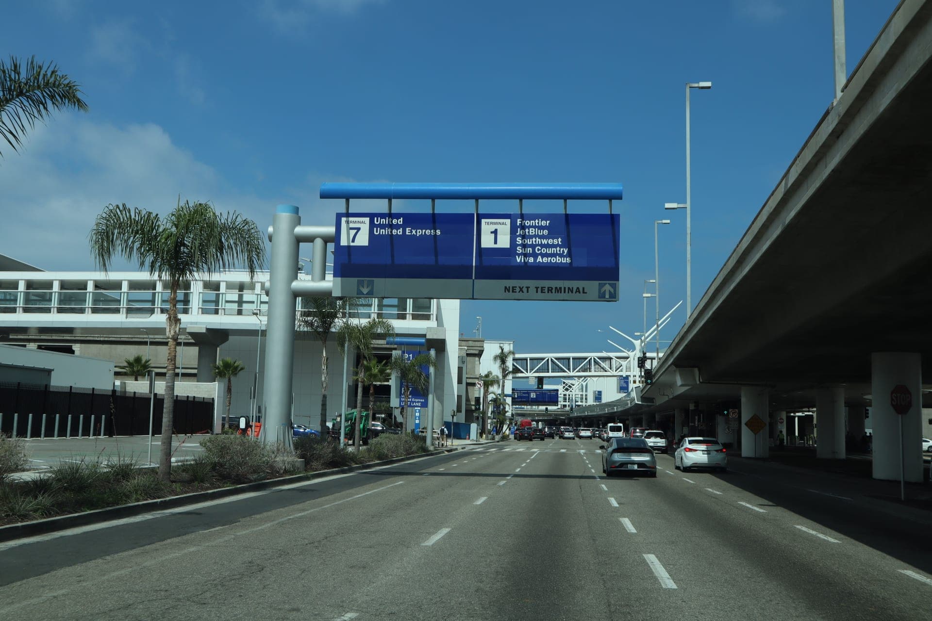 LAX terminal signs for Terminal 7 United and Terminal 1 Southwest, JetBlue, Frontier — VIP City Rides picks up curbside at every terminal