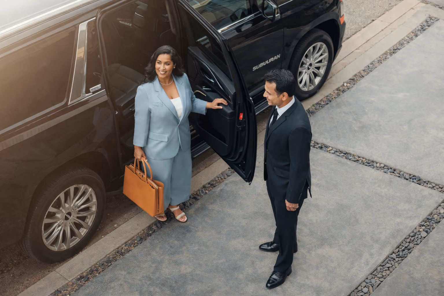 Client exiting a luxury black SUV