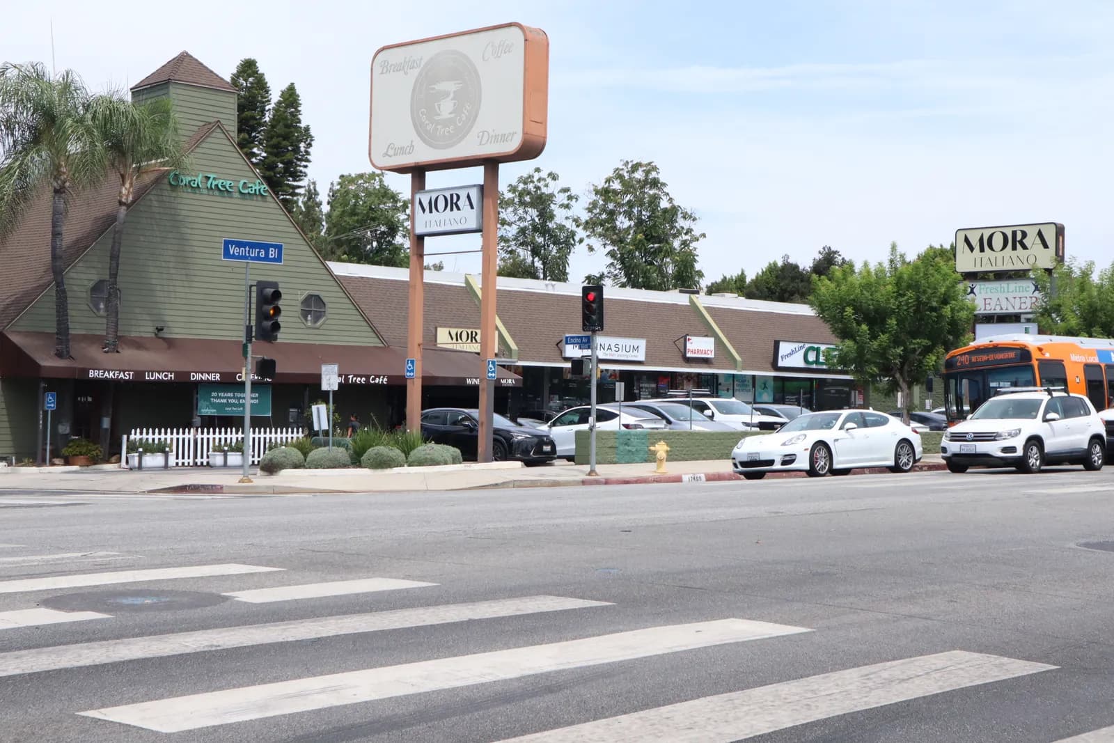 A Ventura Boulevard intersection in Encino with storefronts and palm trees
